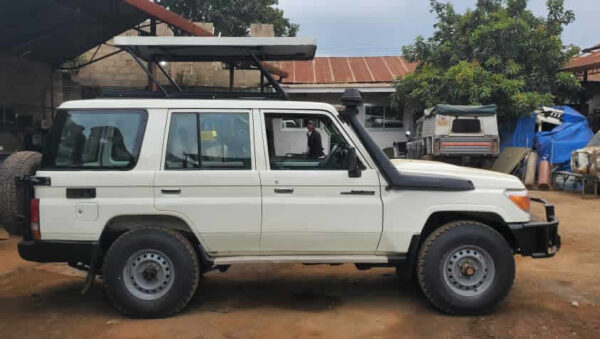 C:\Users\Hp\OneDrive\Desktop\Websites\ActiveUgandaSafaris\cars\new images\Finished\toyota land cruiser 78 series troop carrier troopy